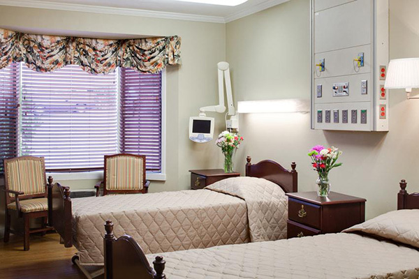 Patients beds at Ballard Center with nursing equipment