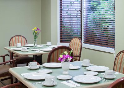 Set tables in the dining room at the Ballard Center